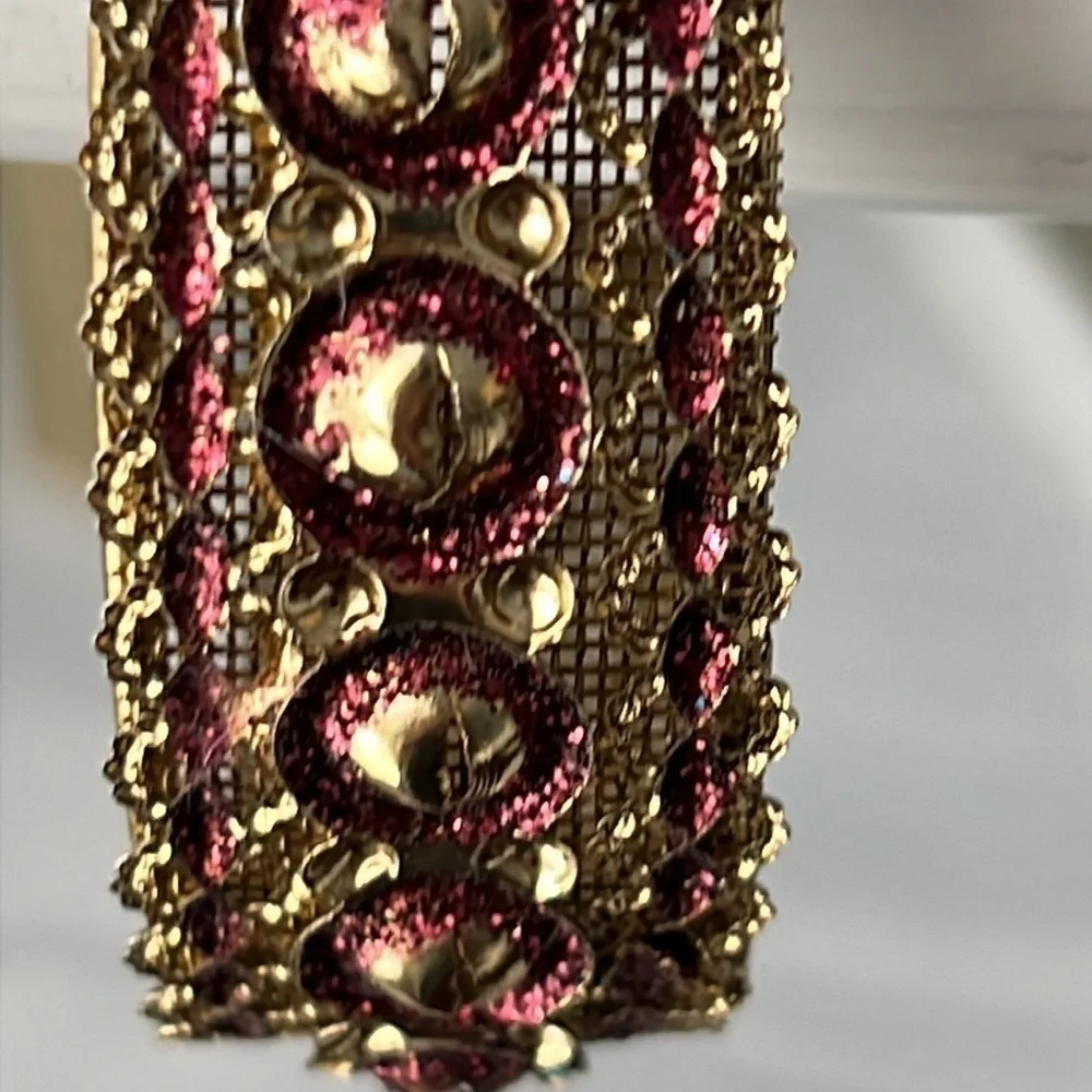 Gold filigree bangle with red accents